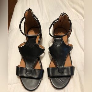 New pair of woman’s black sandals with zipper on back, size 8 no tags